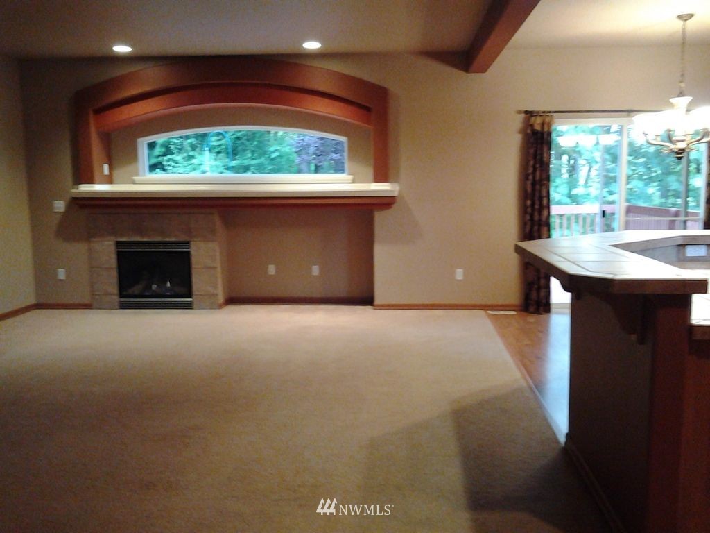 23812 22nd Avenue West Bothell, WA 98021 - Photo 8 of 19 a view of empty room with a fireplace and window