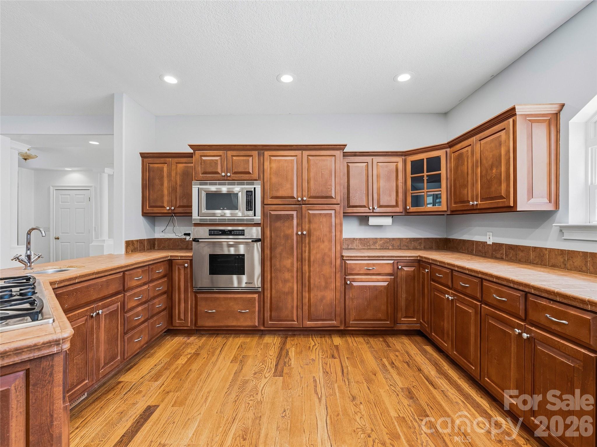 196 Blackbird Lane Tryon, NC 28782 - Photo 15 of 44 a kitchen with stainless steel appliances granite countertop a refrigerator and a stove top oven