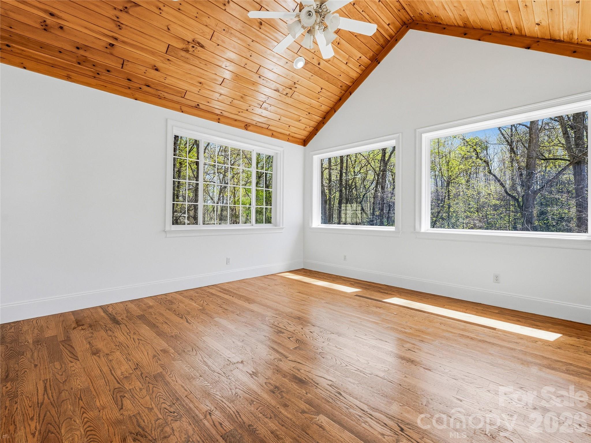 196 Blackbird Lane Tryon, NC 28782 - Photo 18 of 44 a view of an empty room with wooden floor and a window