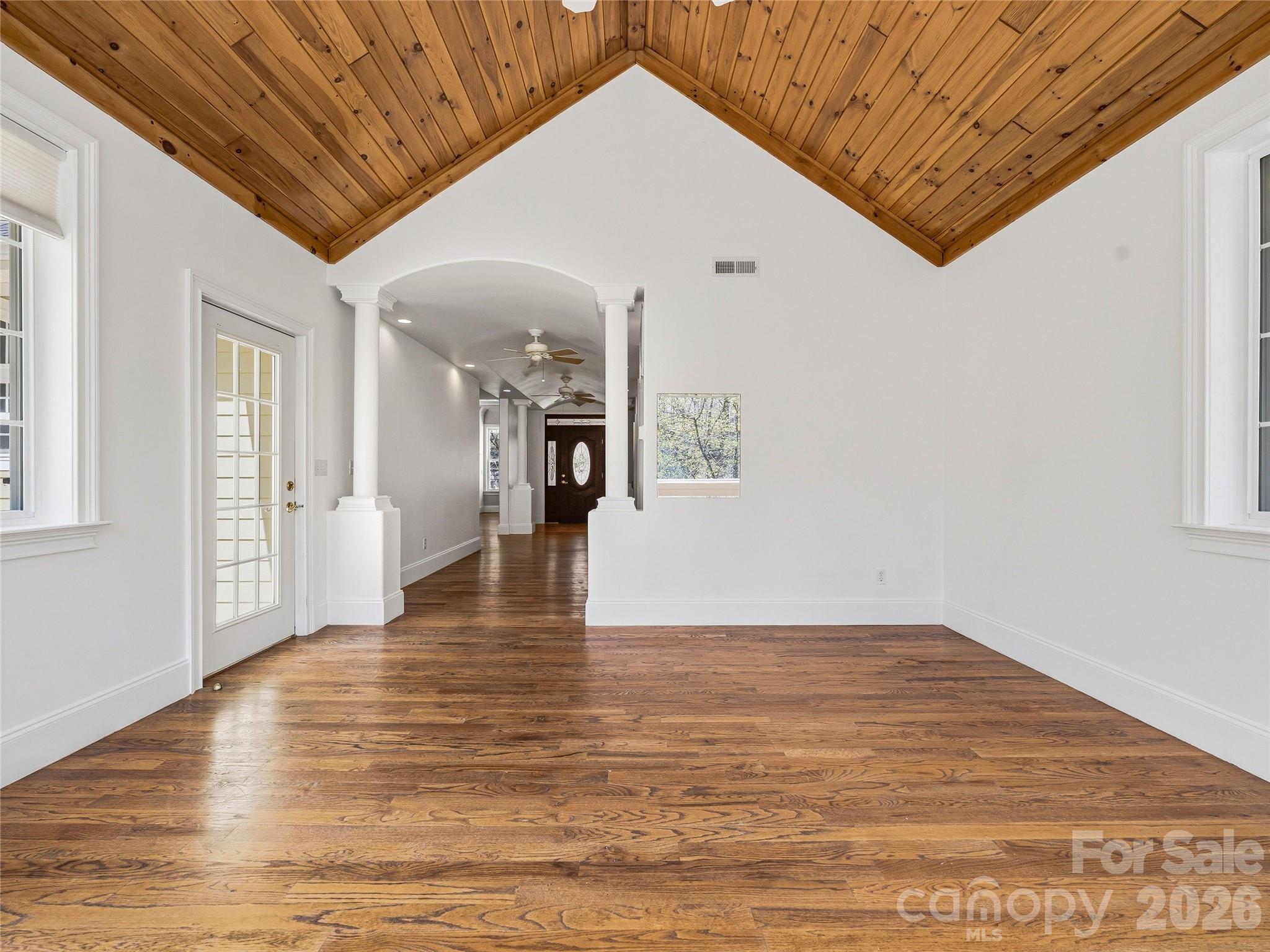 196 Blackbird Lane Tryon, NC 28782 - Photo 19 of 44 a view of an empty room with wooden floor and a window