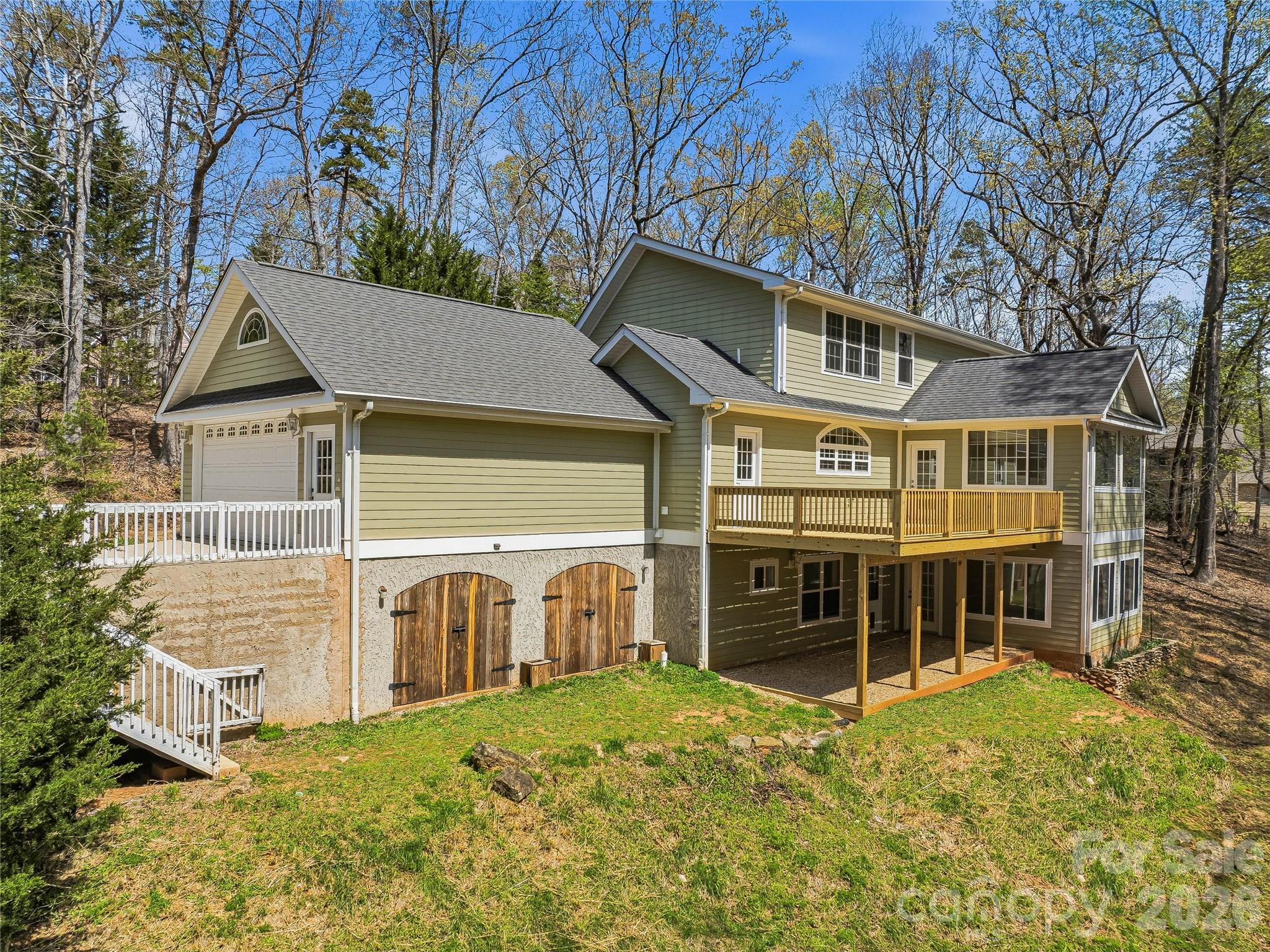 196 Blackbird Lane Tryon, NC 28782 - Photo 2 of 44 a view of a house with a yard and balcony