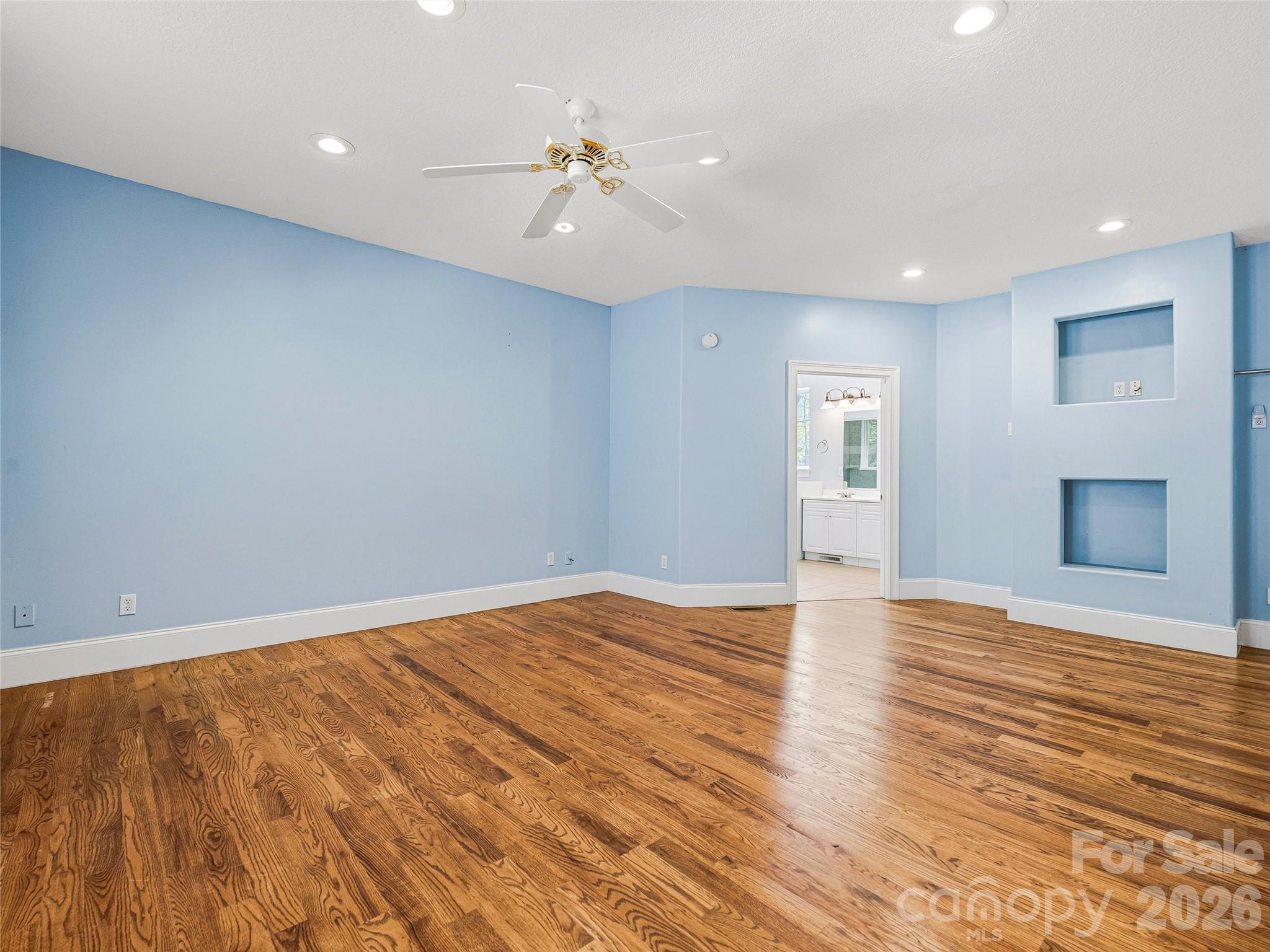 196 Blackbird Lane Tryon, NC 28782 - Photo 24 of 44 a view of an empty room with wooden floor and a window