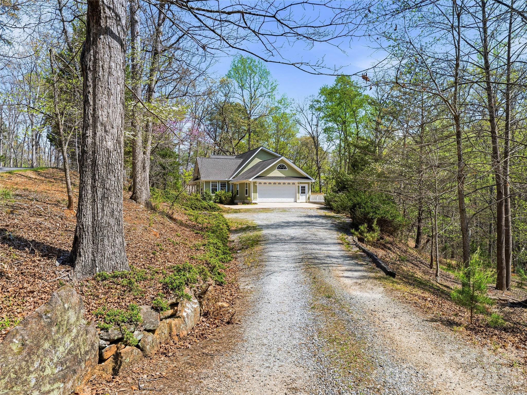 196 Blackbird Lane Tryon, NC 28782 - Photo 3 of 44 a house with trees in front of it
