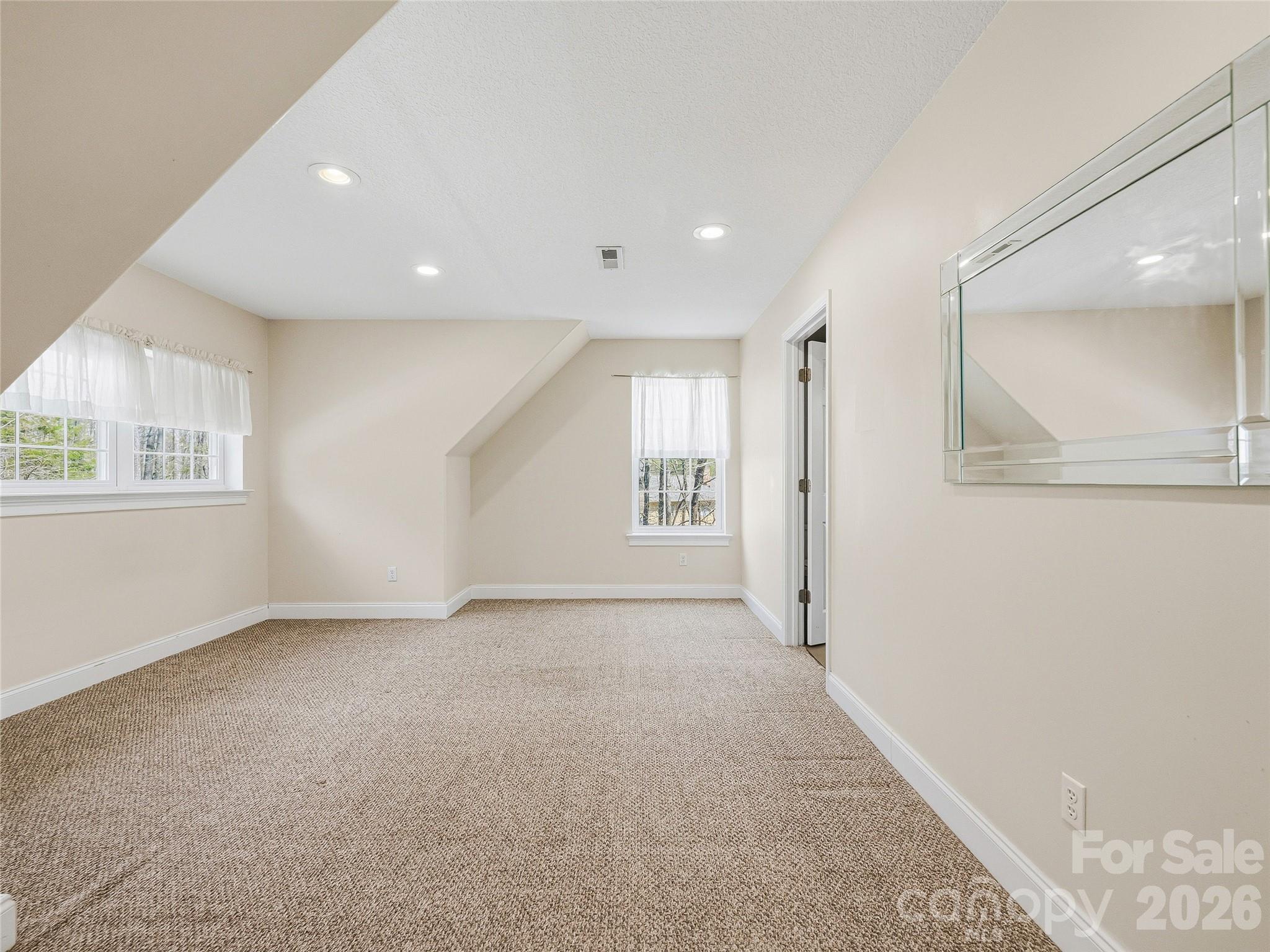 196 Blackbird Lane Tryon, NC 28782 - Photo 33 of 44 an empty room with windows and closet