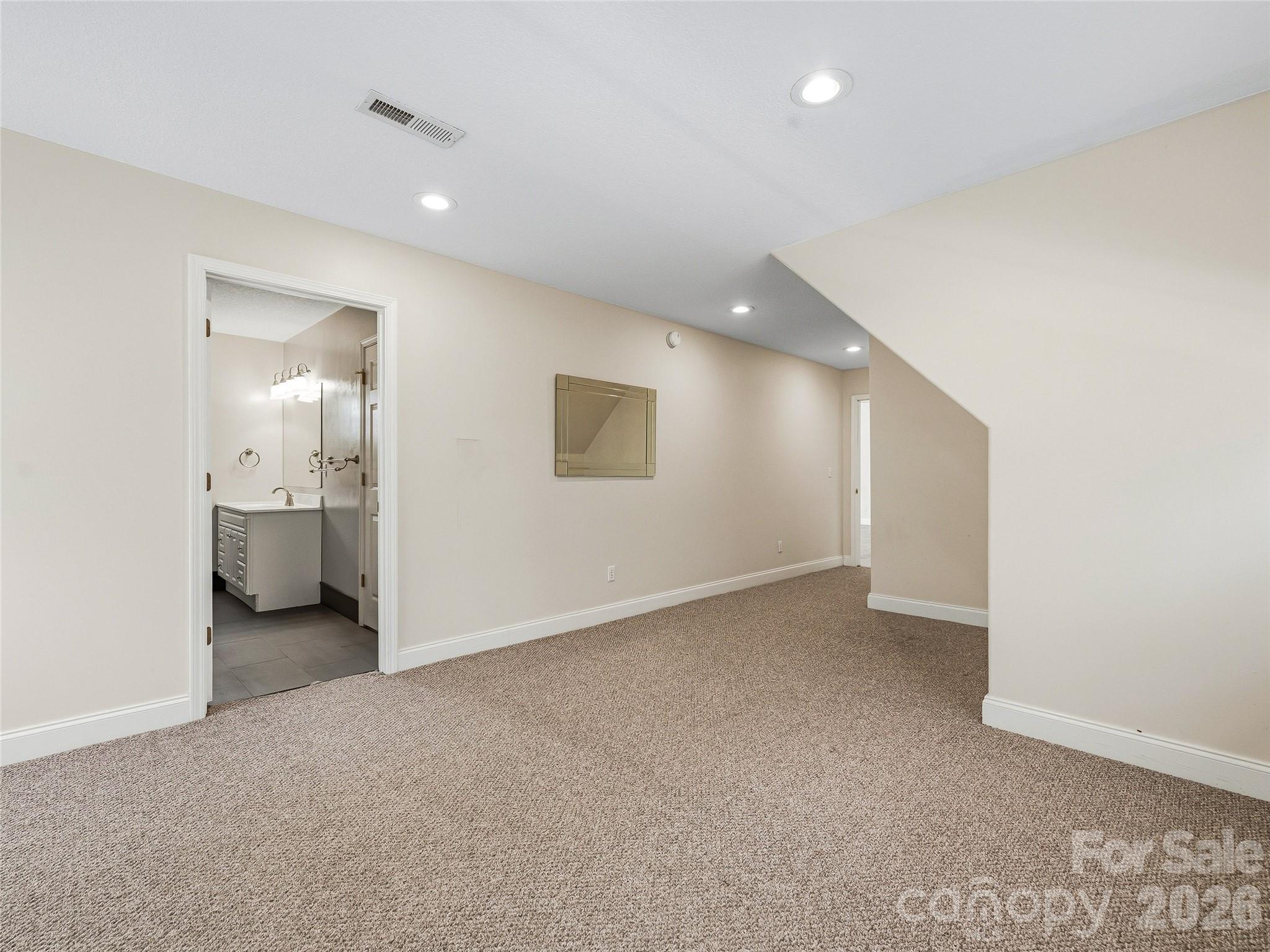 196 Blackbird Lane Tryon, NC 28782 - Photo 34 of 44 an empty room with a bathroom and a sink
