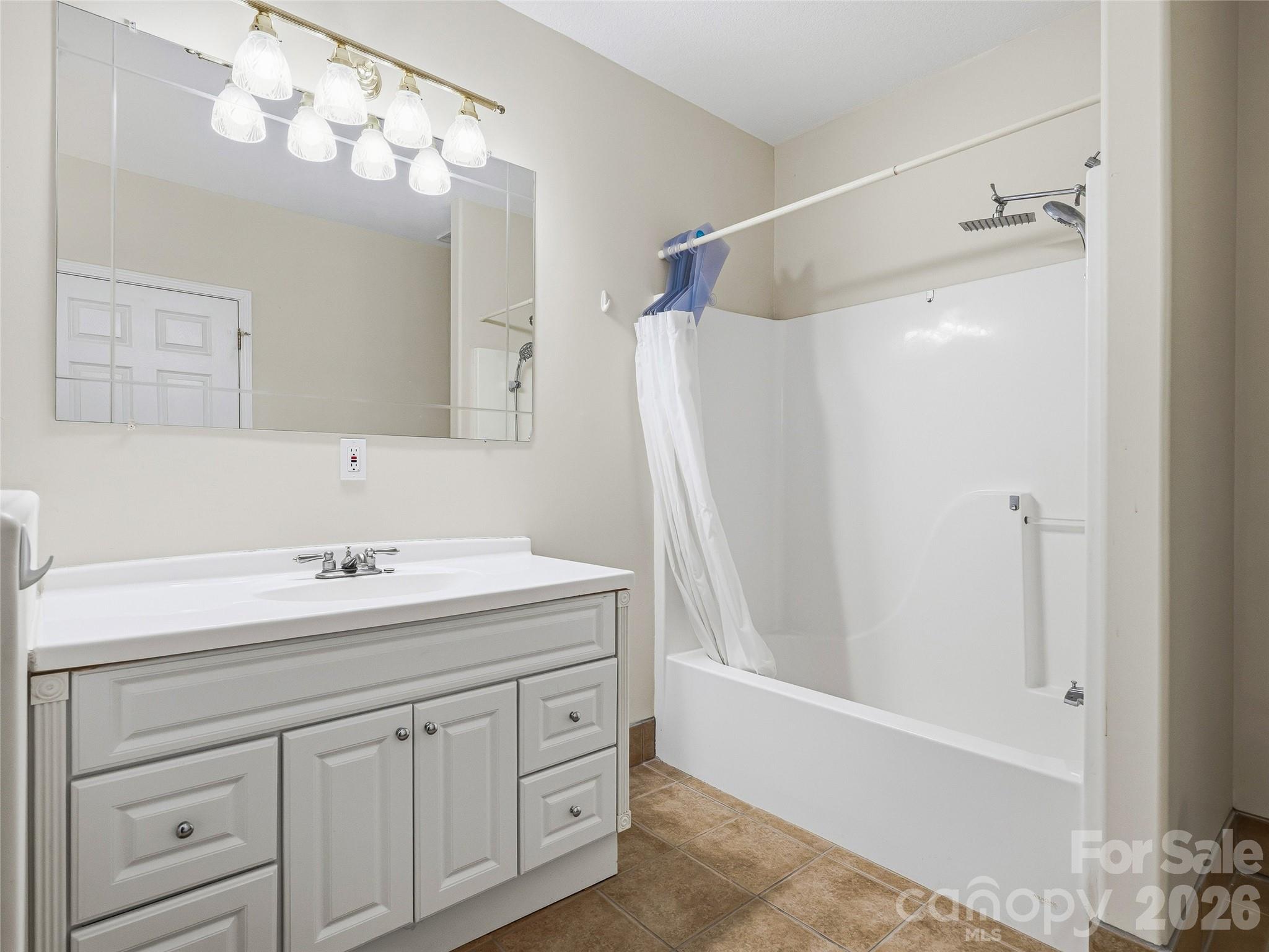 196 Blackbird Lane Tryon, NC 28782 - Photo 41 of 44 a bathroom with a sink double vanity and a mirror