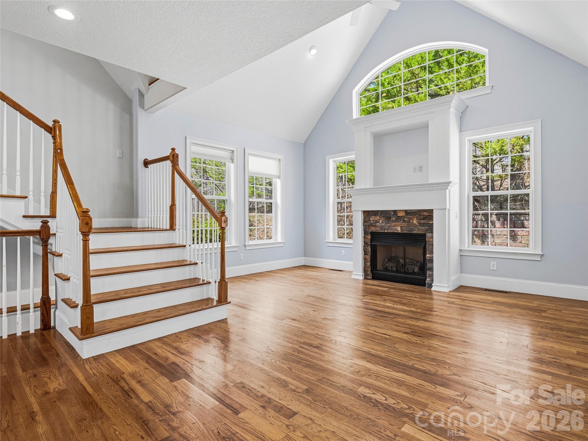 196 Blackbird Lane Tryon, NC 28782 - Photo 9 of 44 a view of an empty room with a fireplace and a window