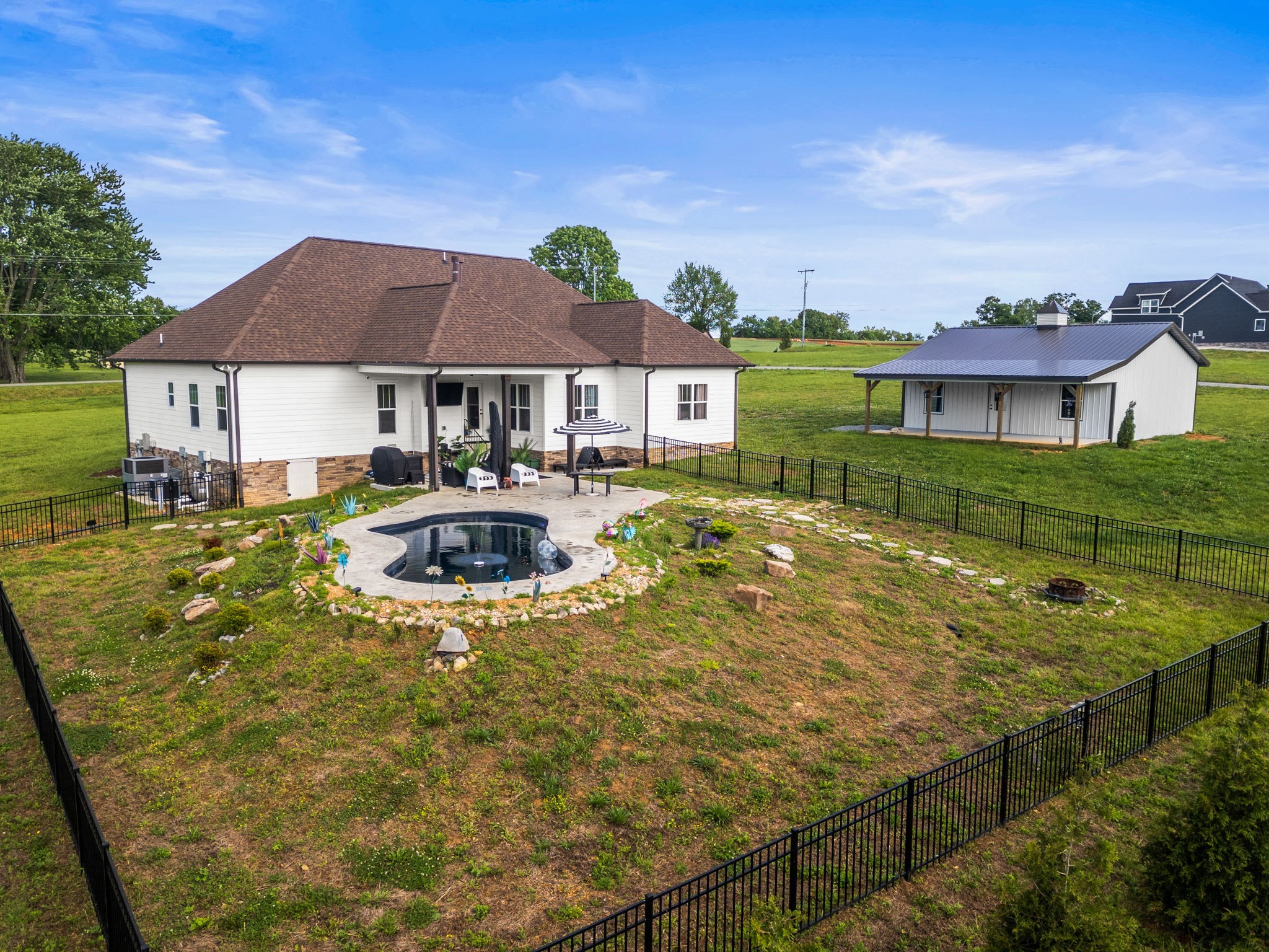 3378 New Hall Road Greenbrier, TN 37073 - Photo 63 of 83 a view of a house with pool and a yard