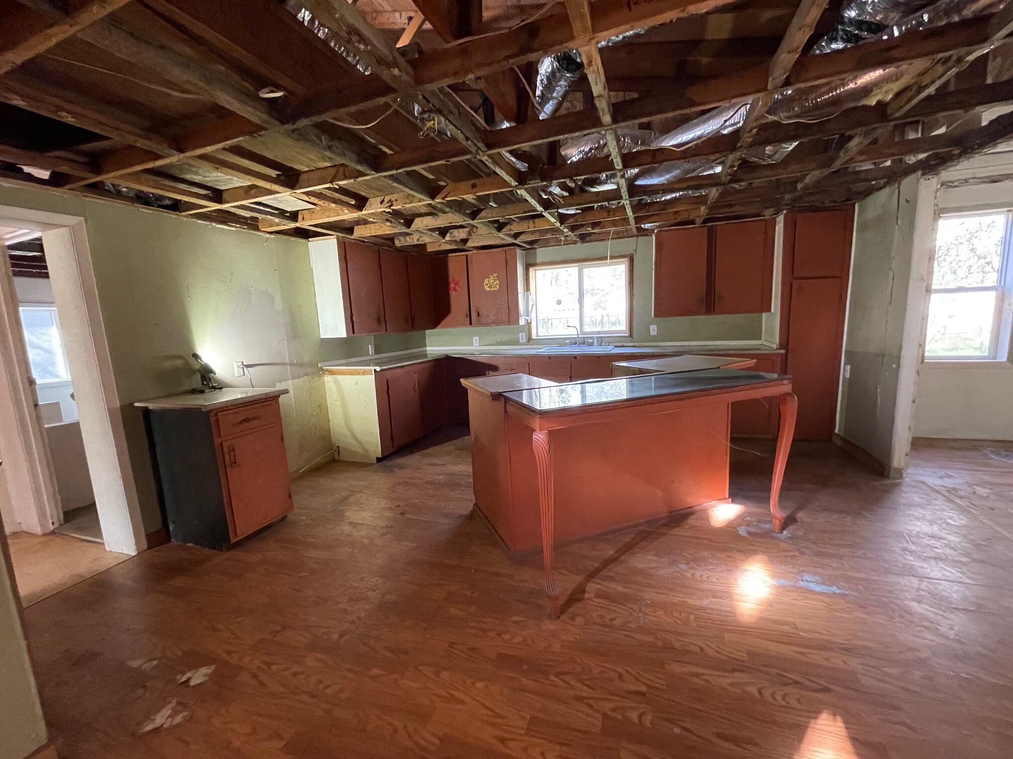 411 South Old Stage Road Cave Junction, OR 97523 - Photo 16 of 39 a open kitchen with stainless steel appliances granite countertop a sink counter space and a window