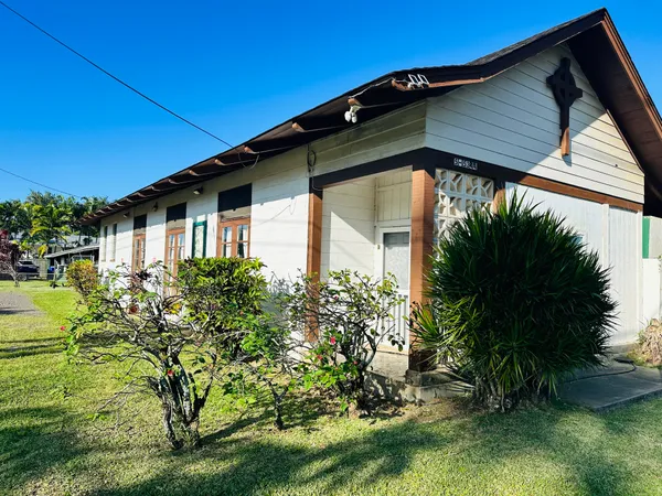a front view of a house with garden