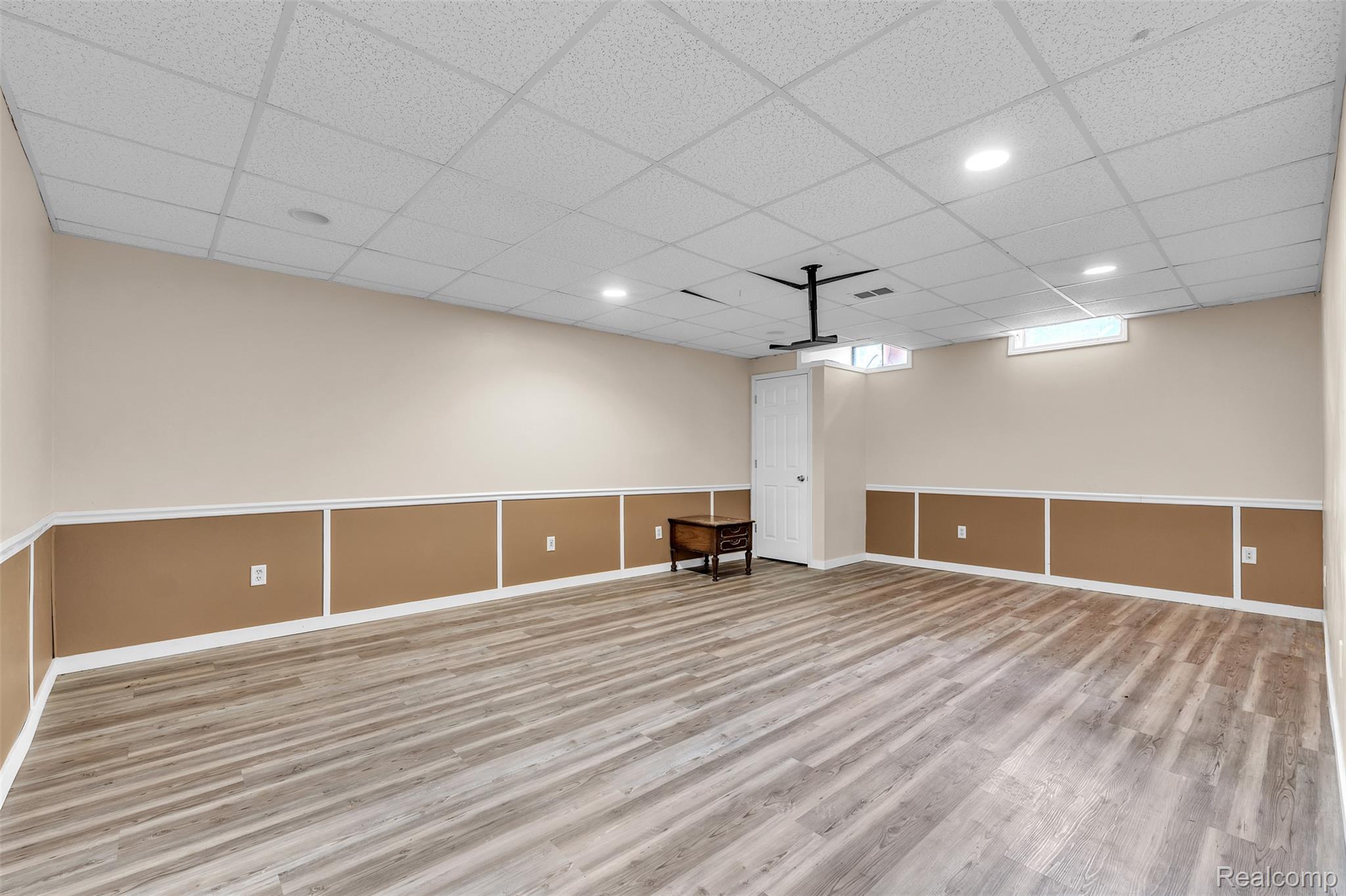 1345 Ives Road Mason, MI 48854 - Photo 37 of 92 Basement with a paneled ceiling, light wood-style flooring, and recessed lighting
