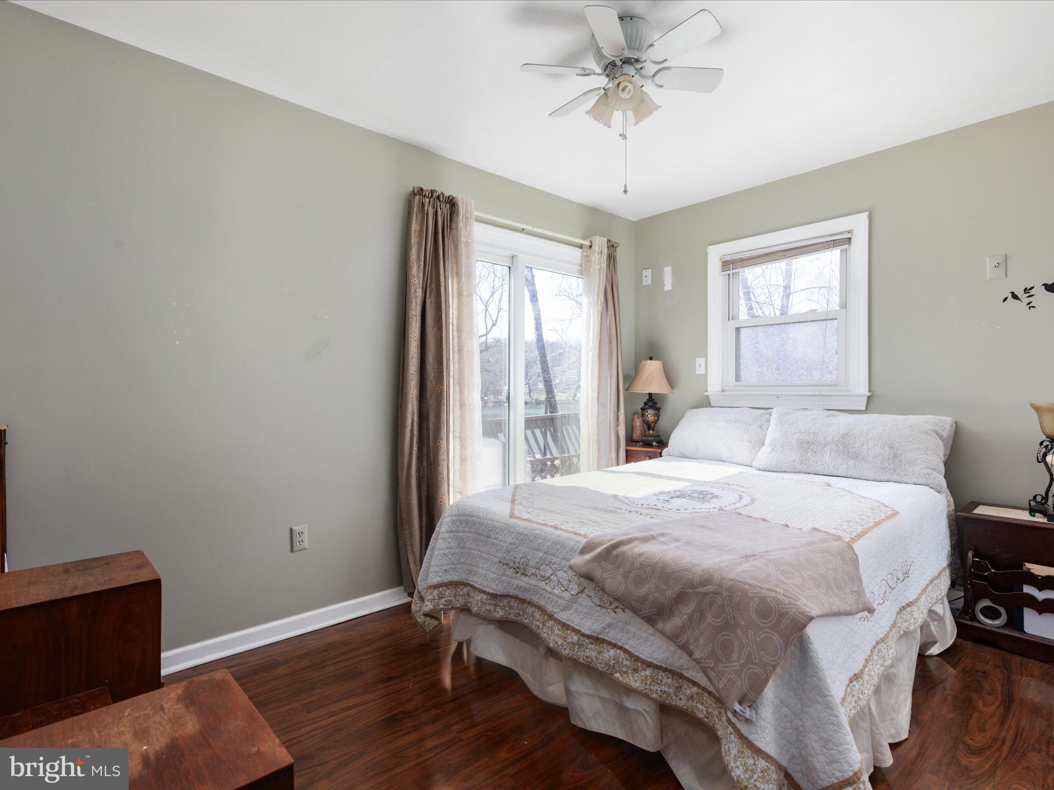 646 Old Dam Road Front Royal, VA 22630 - Photo 12 of 88 a bedroom with a bed and wooden floor