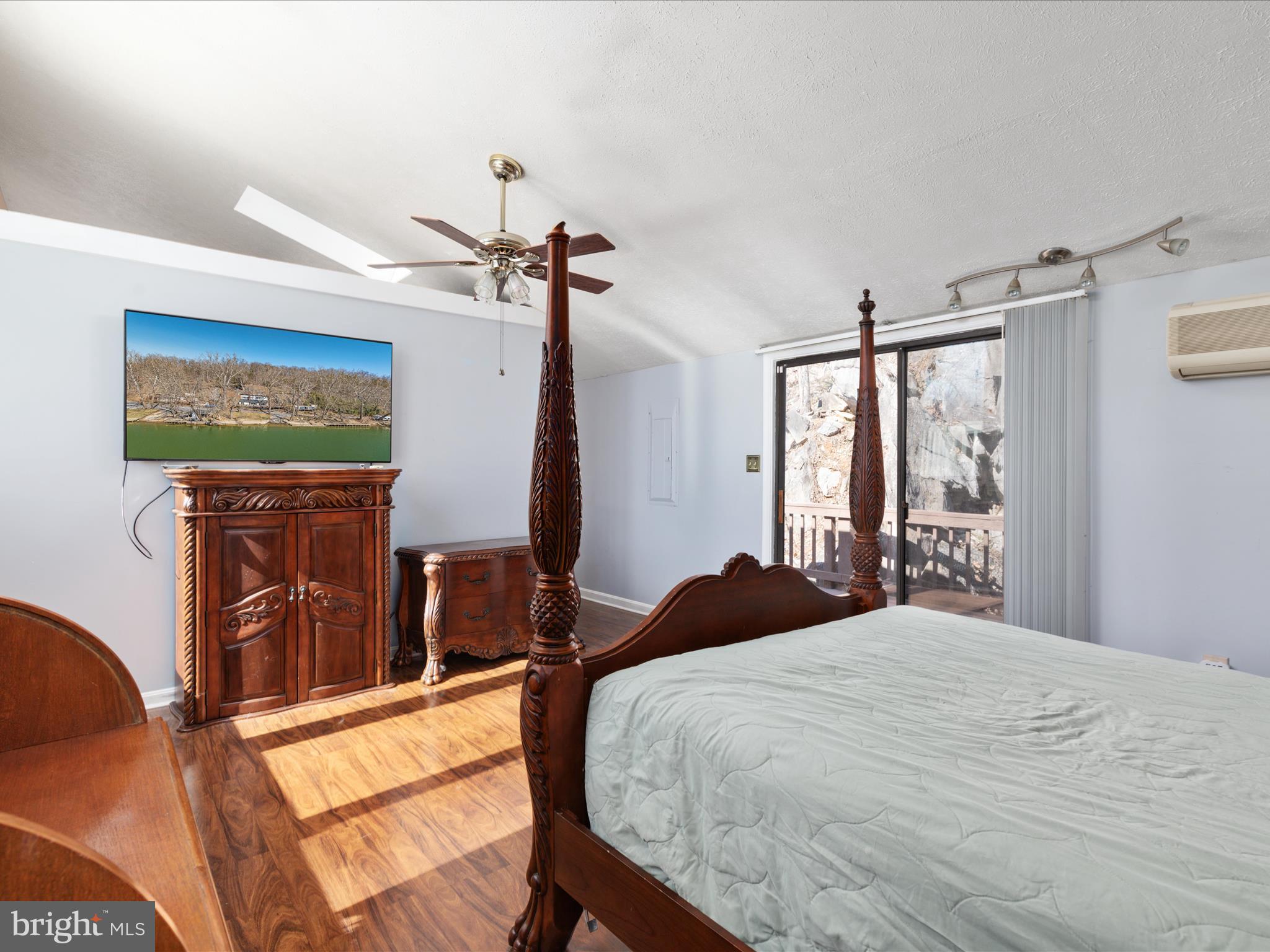 646 Old Dam Road Front Royal, VA 22630 - Photo 20 of 88 a bedroom with a bed a flat screen tv and a dresser