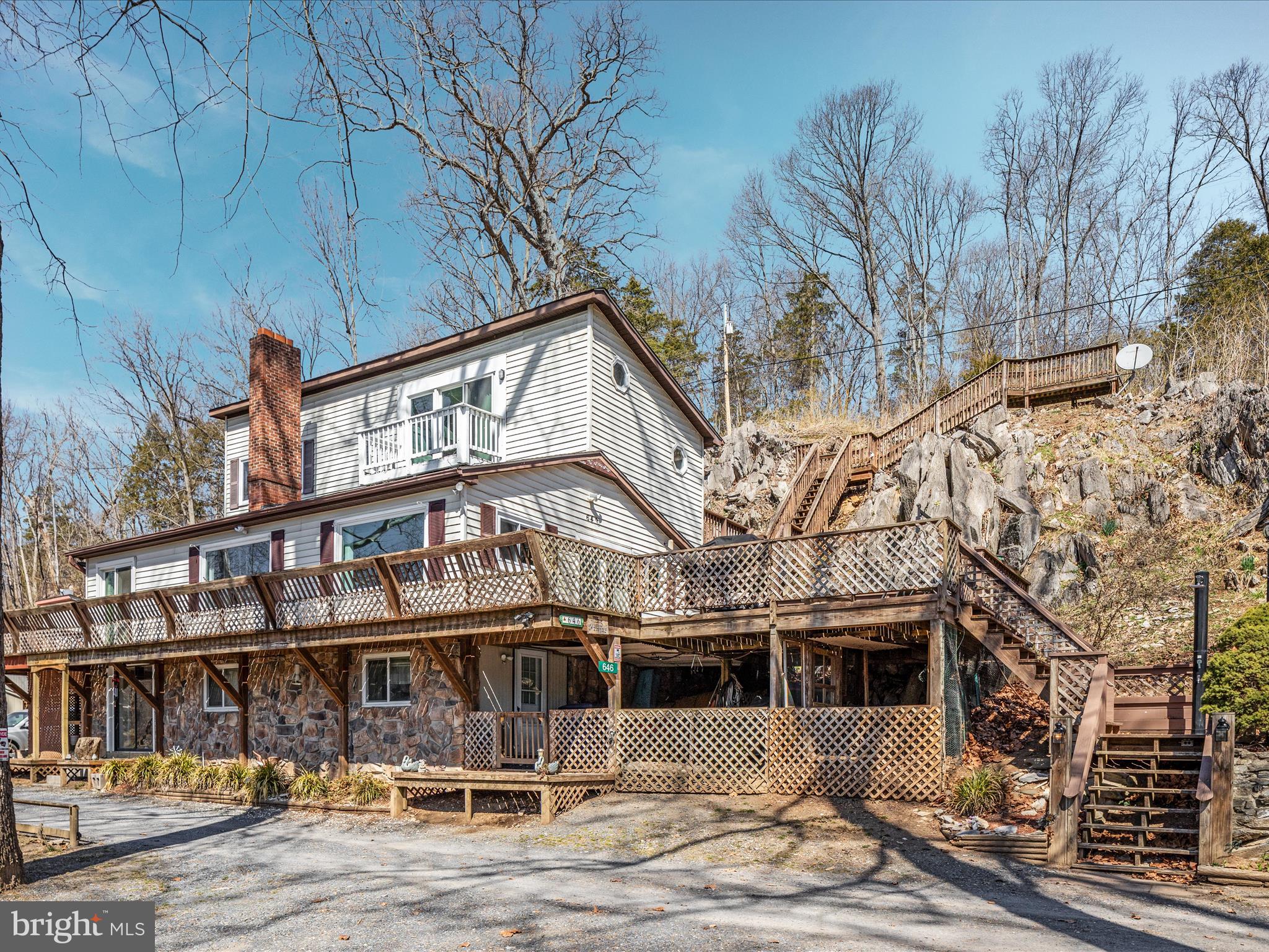 646 Old Dam Road Front Royal, VA 22630 - Photo 55 of 88 a front view of a building with large trees