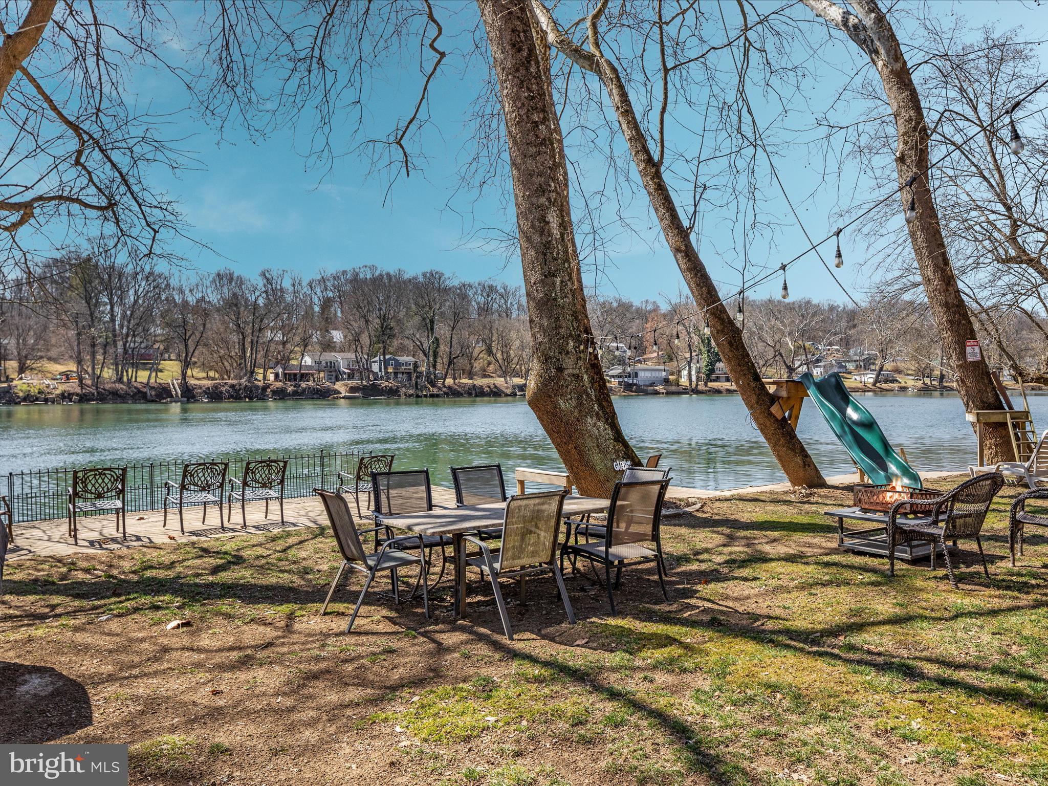 646 Old Dam Road Front Royal, VA 22630 - Photo 57 of 88 a view of a lake with a table and chairs
