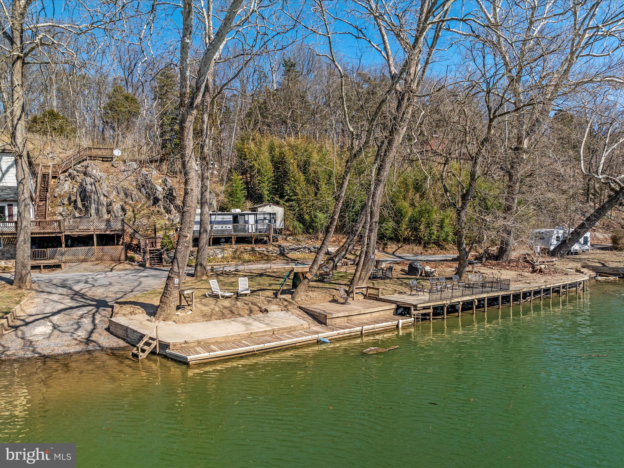 646 Old Dam Road Front Royal, VA 22630 - Photo 62 of 88 a view of swimming pool with a table and chairs