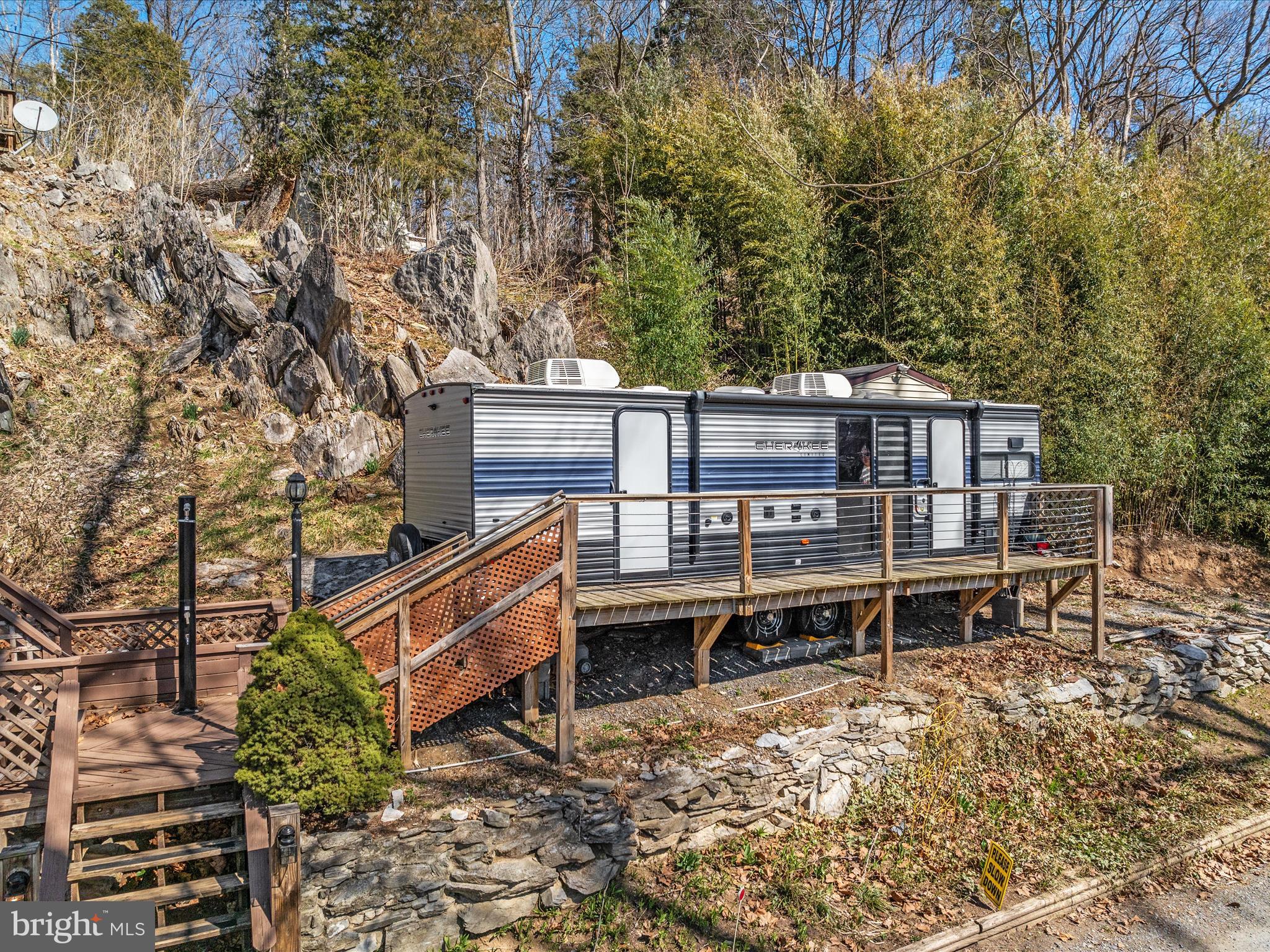 646 Old Dam Road Front Royal, VA 22630 - Photo 68 of 88 a wooden deck with trees in front of it