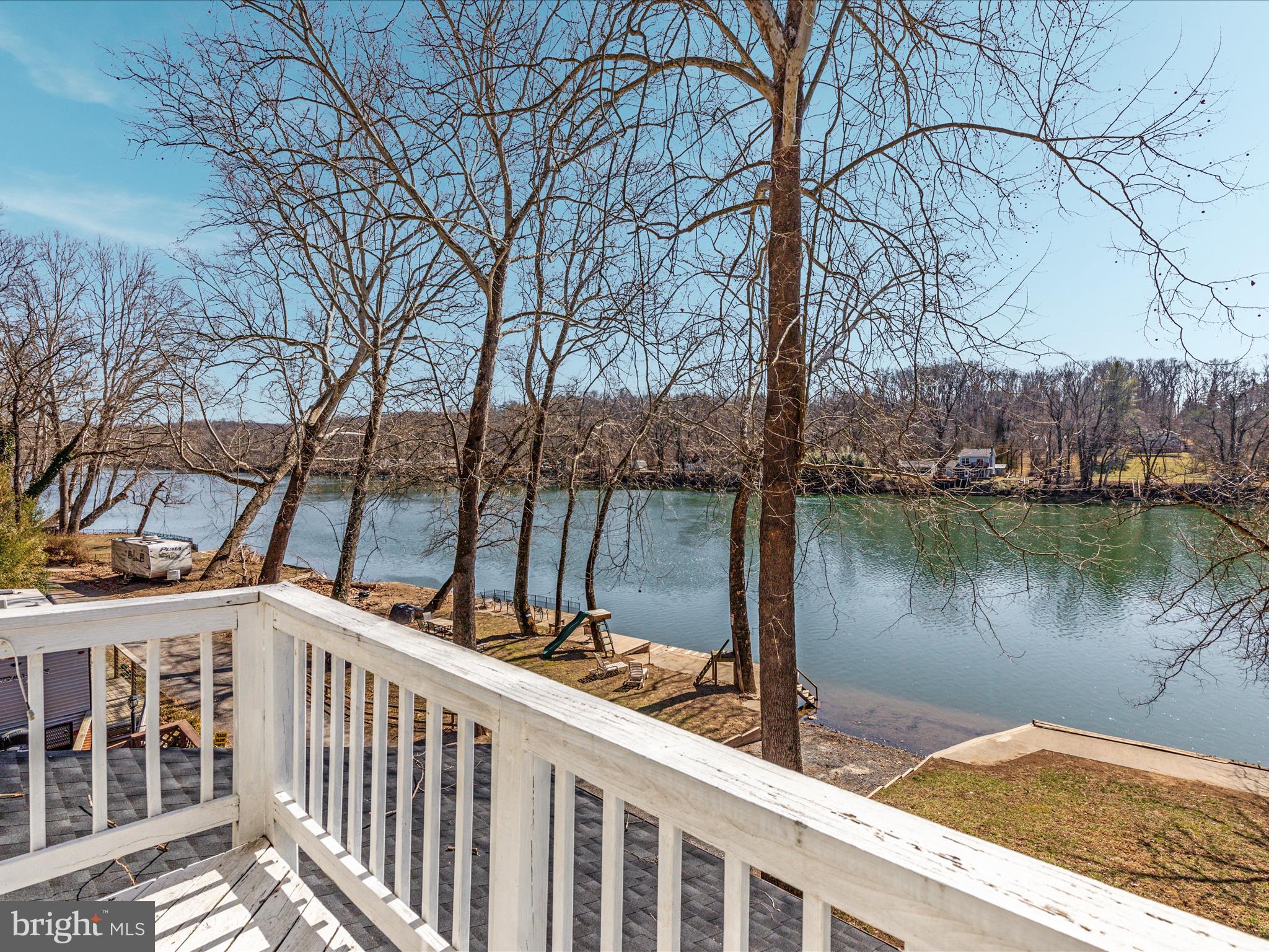 646 Old Dam Road Front Royal, VA 22630 - Photo 77 of 88 a view of a house with a large tree and wooden fence