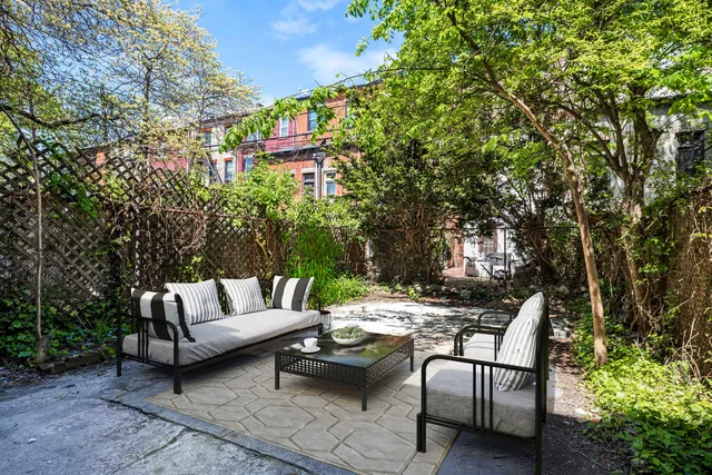 a view of a room with wooden floor and windows