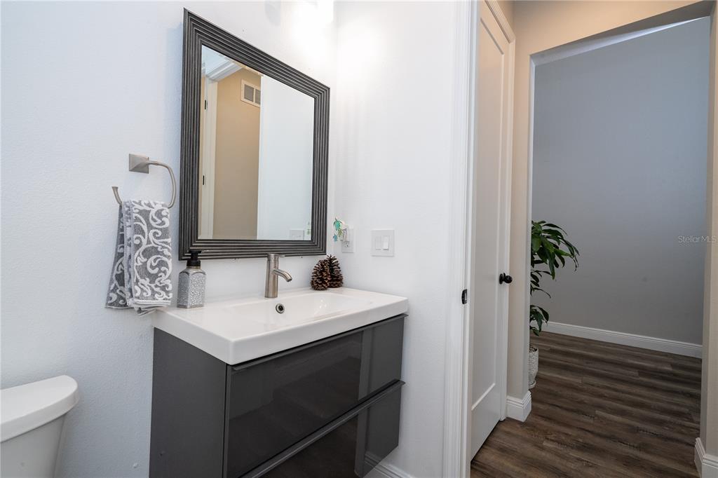 16894 Wingspread Loop Winter Garden, FL 34787 - Photo 14 of 53 a bathroom with a sink and a mirror