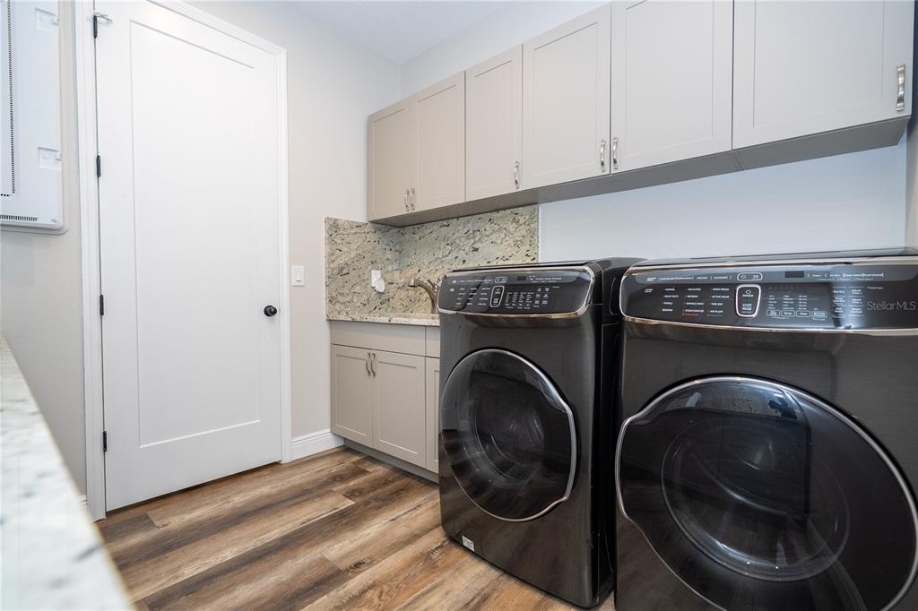 16894 Wingspread Loop Winter Garden, FL 34787 - Photo 17 of 53 a utility room with washing machine