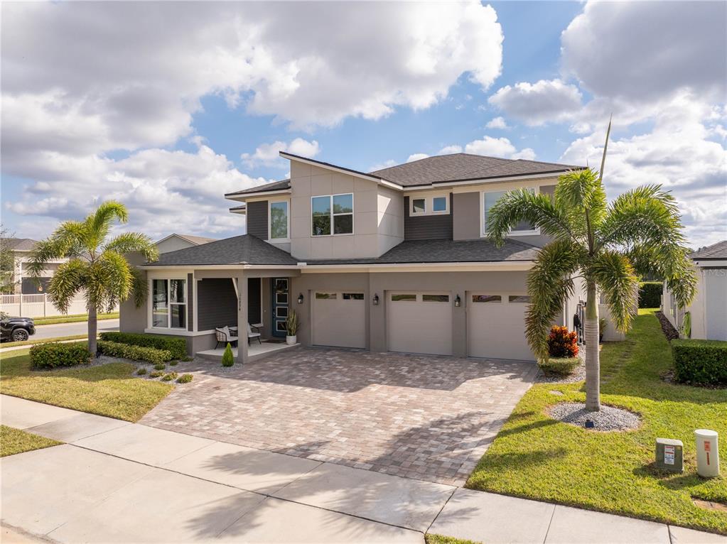 16894 Wingspread Loop Winter Garden, FL 34787 - Photo 2 of 53 a front view of a house with a yard