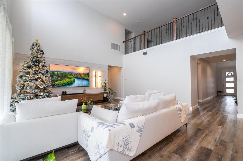 16894 Wingspread Loop Winter Garden, FL 34787 - Photo 21 of 53 a living room with furniture and a large window