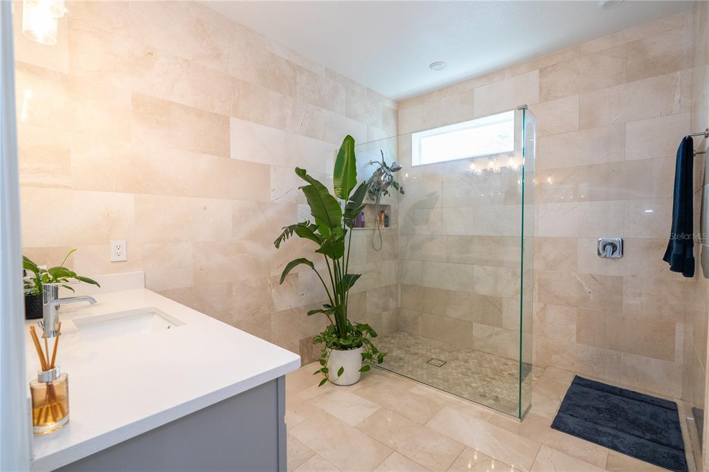16894 Wingspread Loop Winter Garden, FL 34787 - Photo 35 of 53 a white bath tub sitting next to a shower