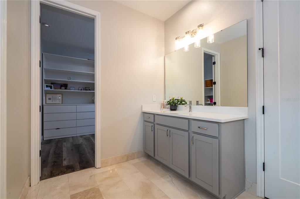 16894 Wingspread Loop Winter Garden, FL 34787 - Photo 36 of 53 a bathroom with a sink and a mirror