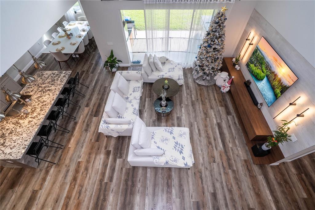 16894 Wingspread Loop Winter Garden, FL 34787 - Photo 38 of 53 a living room with furniture and a flat screen tv