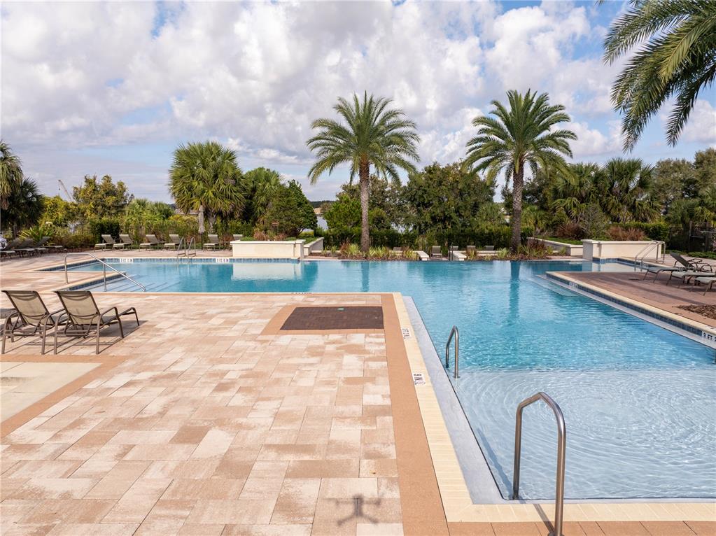 16894 Wingspread Loop Winter Garden, FL 34787 - Photo 50 of 53 a view of swimming pool with outdoor seating and plants