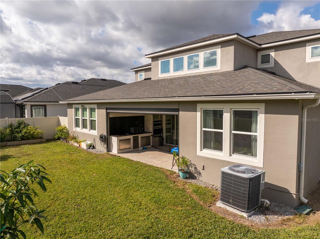 16894 Wingspread Loop Winter Garden, FL 34787 - Photo 7 of 53 a front view of a house with outdoor seating
