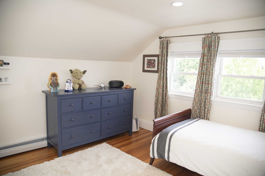3 Chester Road, Unit 3 Belmont, MA 02478 - Photo 32 of 40 a bedroom with a bed and with windows