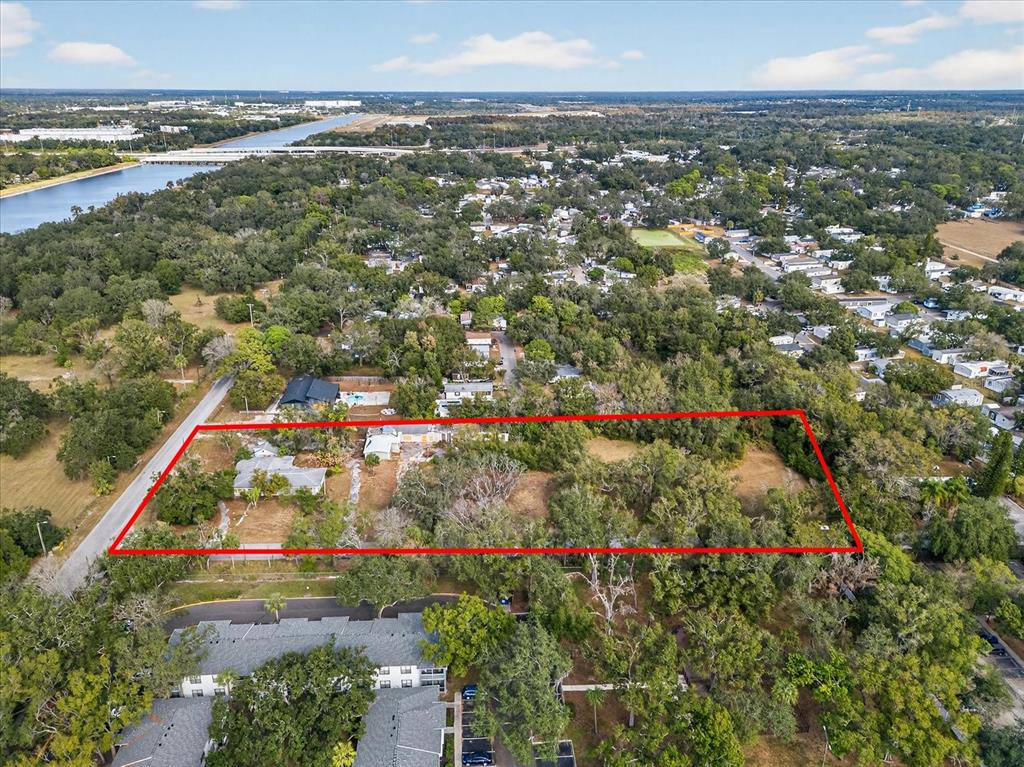 4501 Clewis Avenue Tampa, FL 33610 - Photo 5 of 12 an aerial view of residential houses with outdoor space and trees