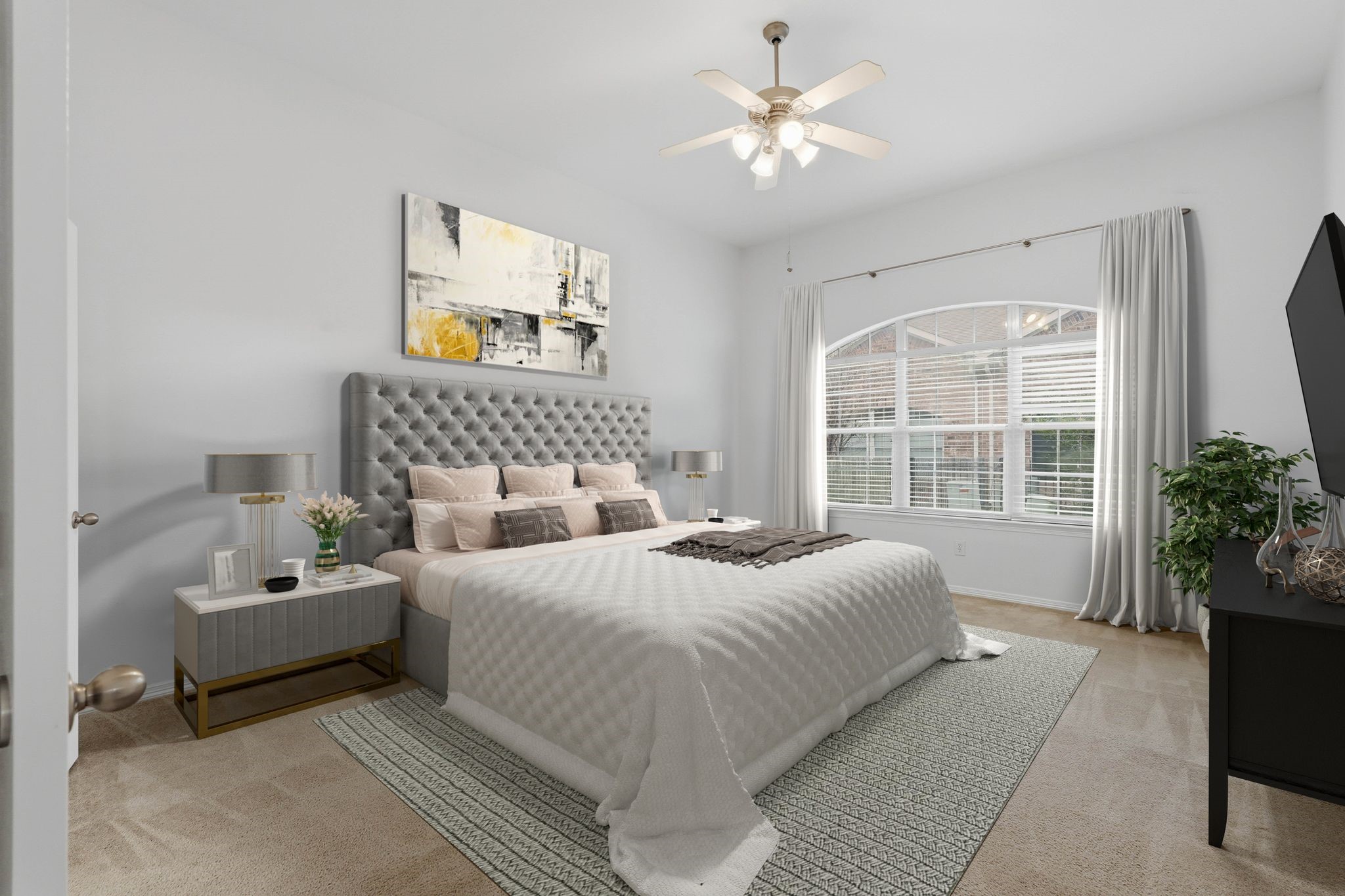 18612 Syndee Loch Court Spring, TX 77379 - Photo 12 of 27 a spacious bedroom with a bed a couch and potted plant