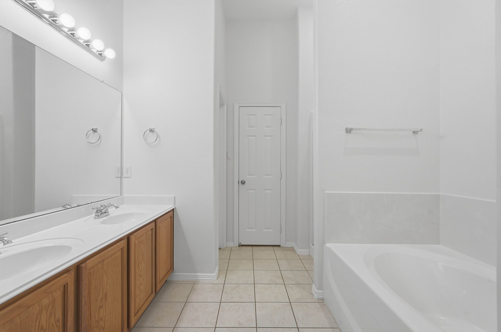 18612 Syndee Loch Court Spring, TX 77379 - Photo 15 of 27 a bathroom with a tub sink and mirror