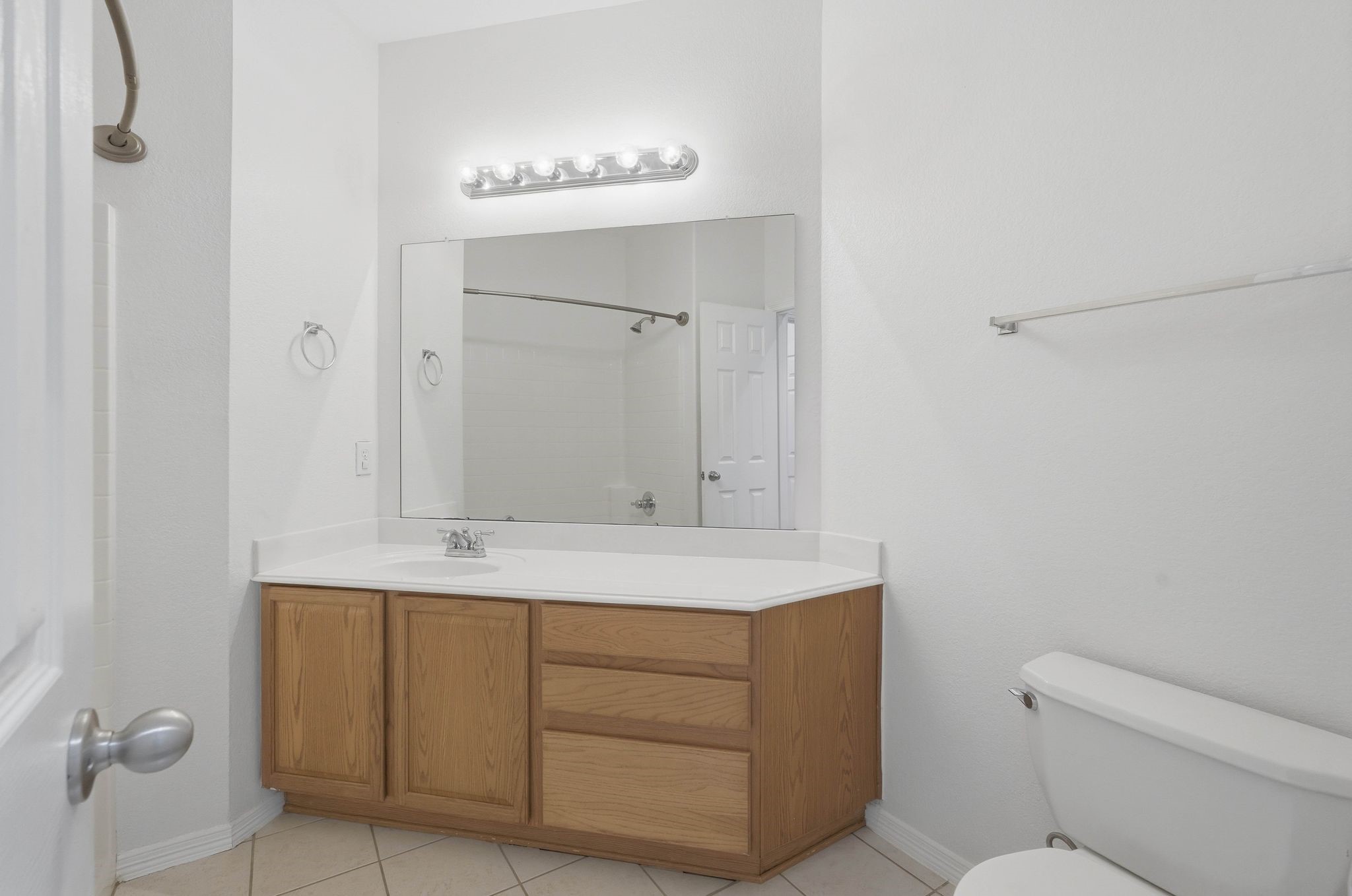 18612 Syndee Loch Court Spring, TX 77379 - Photo 19 of 27 a bathroom with a sink a toilet and a mirror