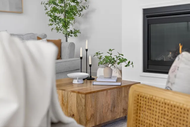 a dining room with furniture a window and a chandelier