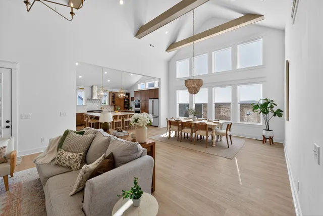 a kitchen with a stove a sink dishwasher a kitchen island with wooden cabinets and floor