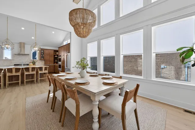 a kitchen with stainless steel appliances granite countertop a refrigerator and a stove