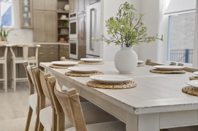 a kitchen with stainless steel appliances granite countertop a refrigerator and a cabinets
