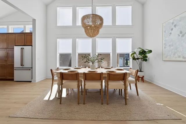 a kitchen with granite countertop a refrigerator and a sink