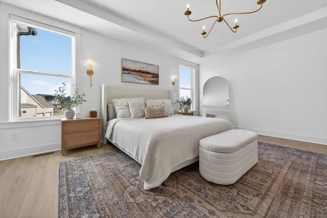 a bedroom with furniture and a window