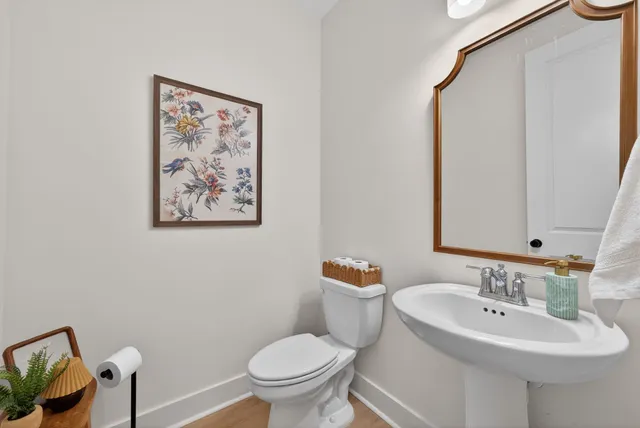 a view of a patio with table and chairs with wooden floor and fence