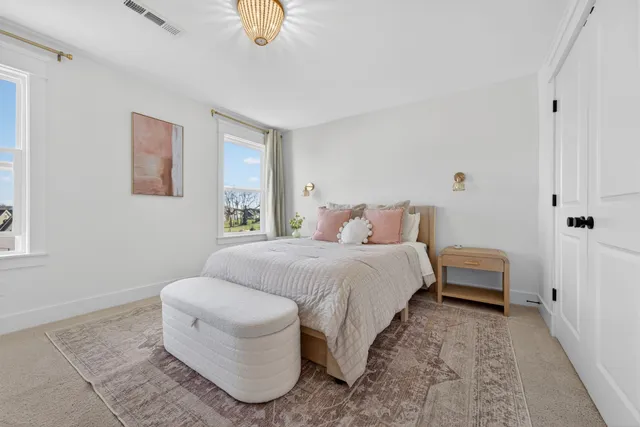an aerial view of a house with garden space and a patio