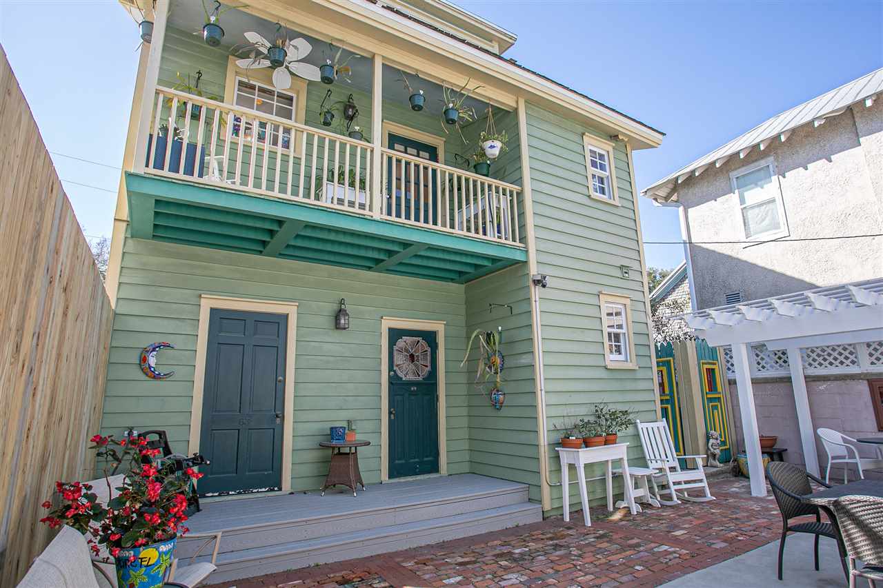 63 Marine Street St. Augustine, FL 32084 - Photo 11 of 42 a front view of a house with a porch