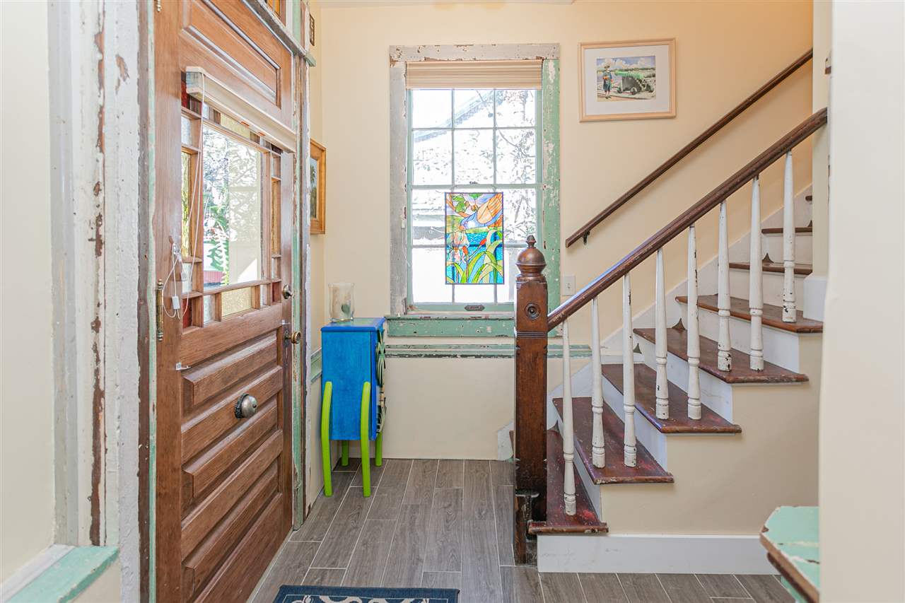 63 Marine Street St. Augustine, FL 32084 - Photo 14 of 42 a view of an entryway with wooden floor and stairs