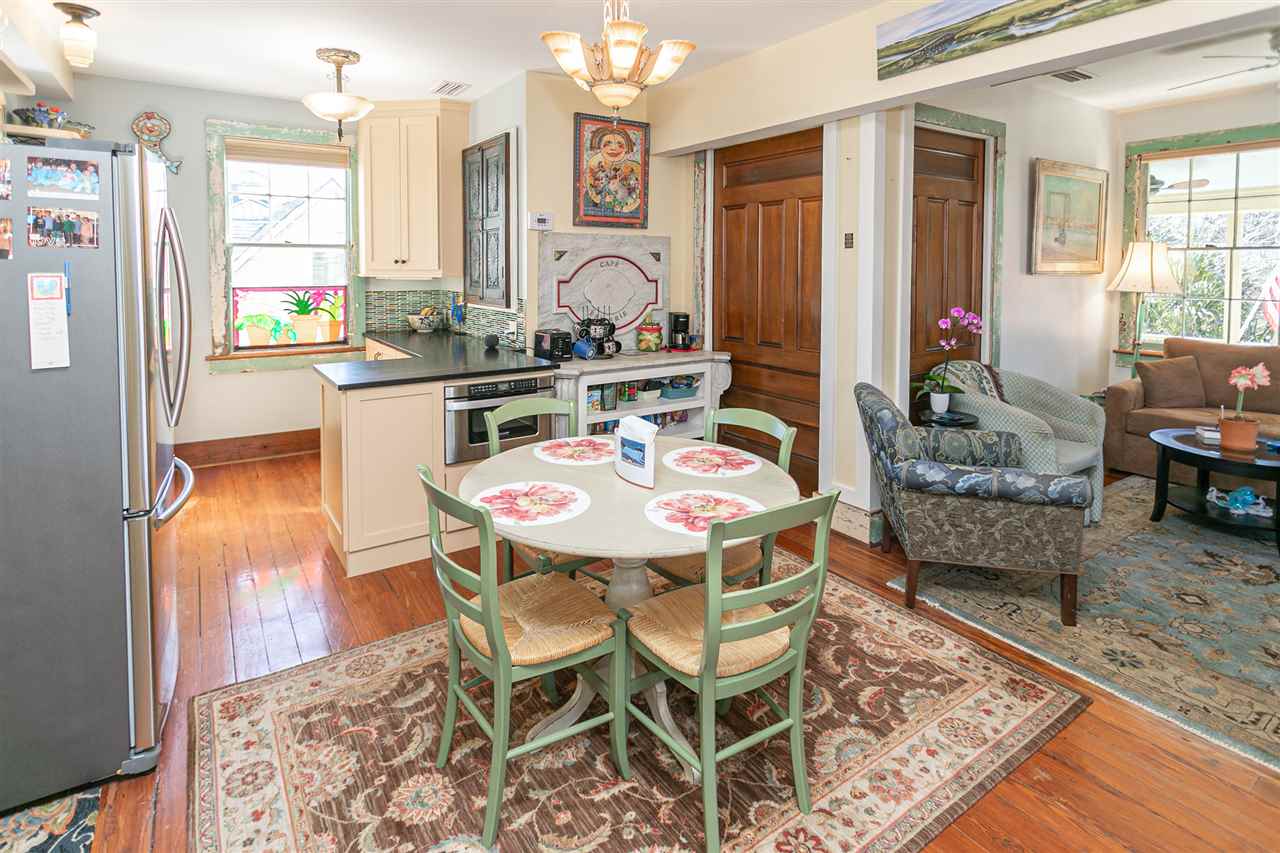63 Marine Street St. Augustine, FL 32084 - Photo 19 of 42 a dining room with furniture and wooden floor