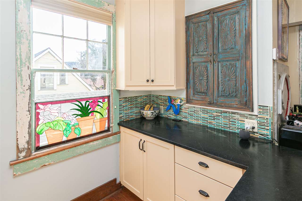 63 Marine Street St. Augustine, FL 32084 - Photo 23 of 42 a kitchen with stainless steel appliances granite countertop a stove a sink and a window