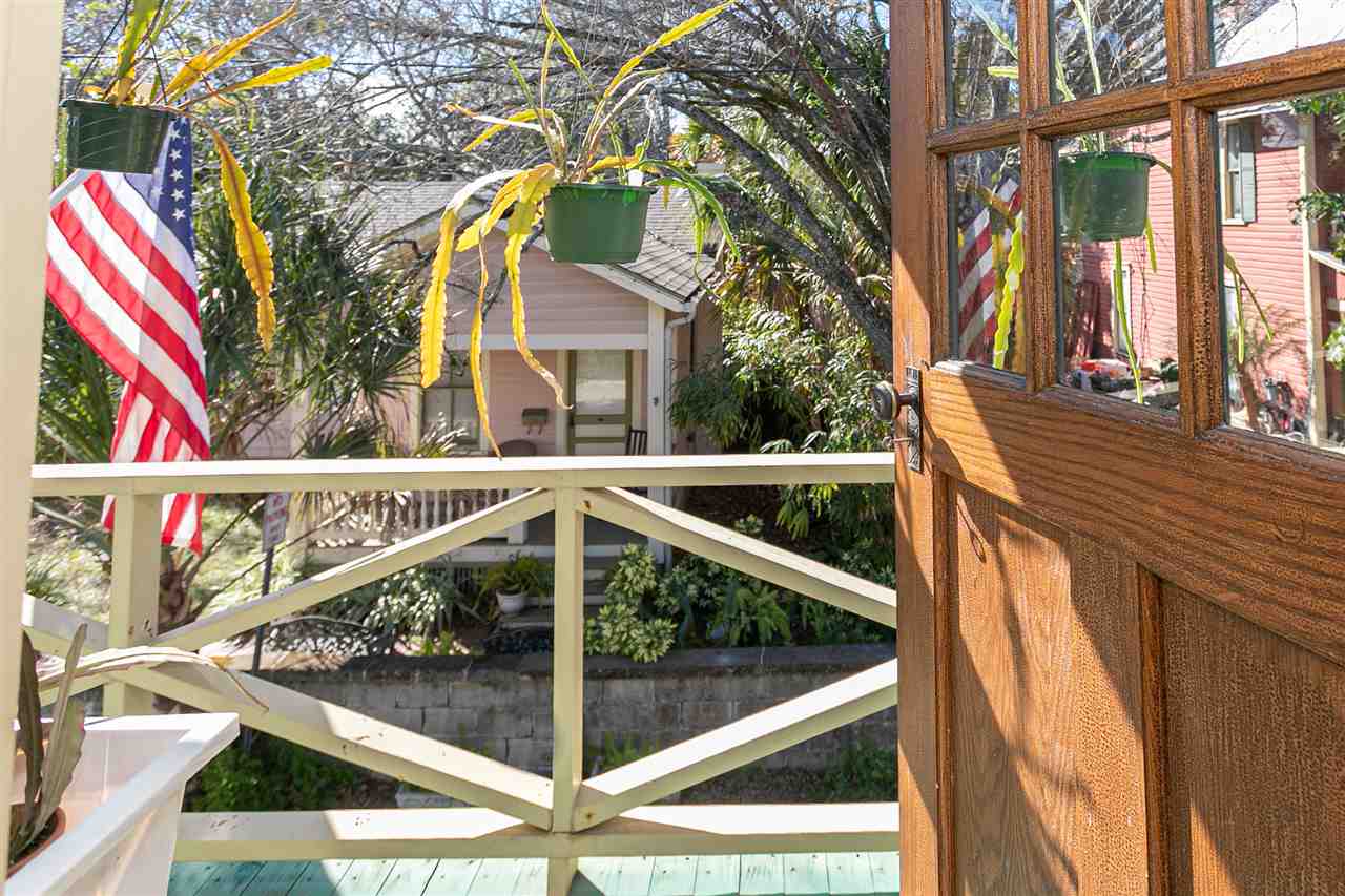 63 Marine Street St. Augustine, FL 32084 - Photo 27 of 42 a view of stairs and a yard from a balcony